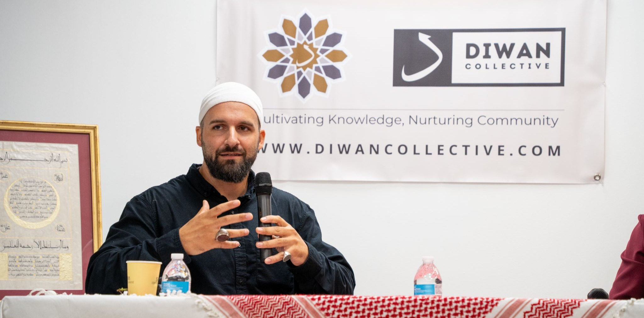 A guest speaker addressing the Diwan Collective community